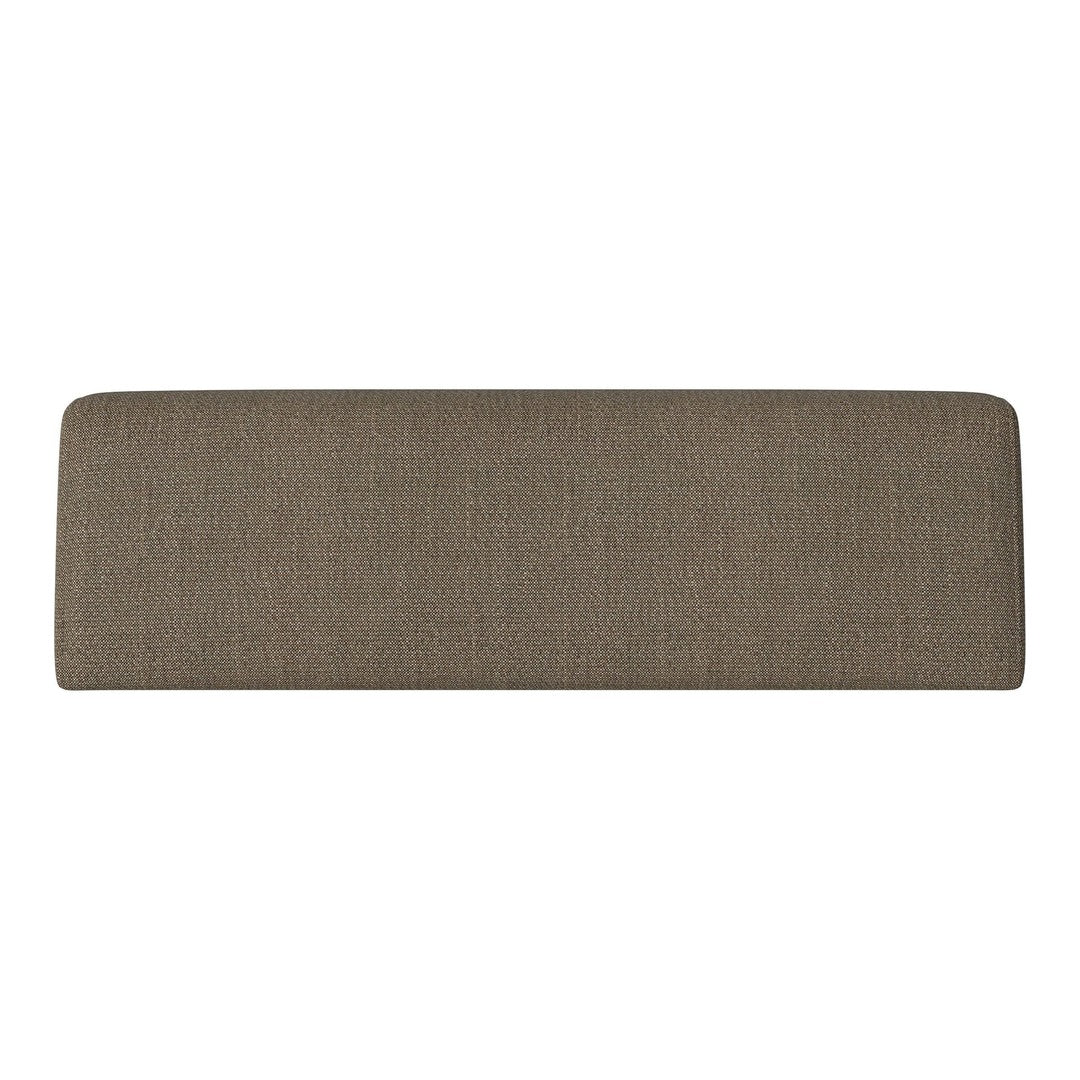 Textured tan headboard with a subtle weave pattern, perfect for contemporary bedroom decor.