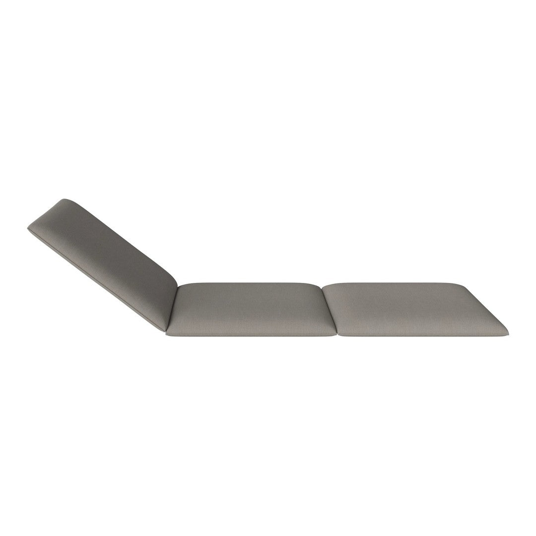 Gray chaise lounge with a smooth, sleek design and minimalistic pattern, perfect for modern decor.