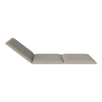Light beige lounging chair with a sleek, minimalist design and subtle textured fabric. Perfect for modern spaces.