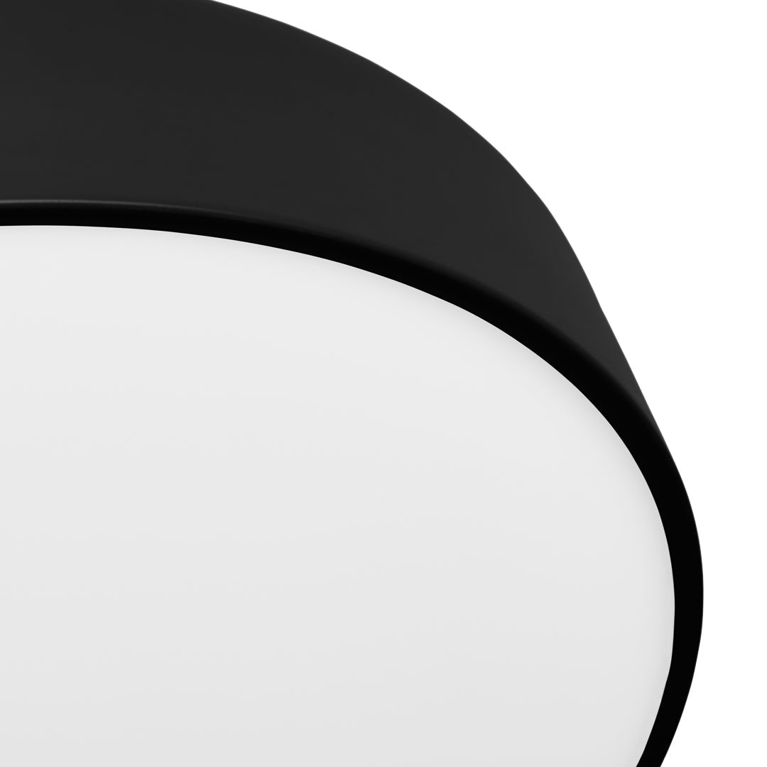 Black circular lamp with a smooth white diffuser, creating a sleek, modern aesthetic. Perfect for contemporary decor.