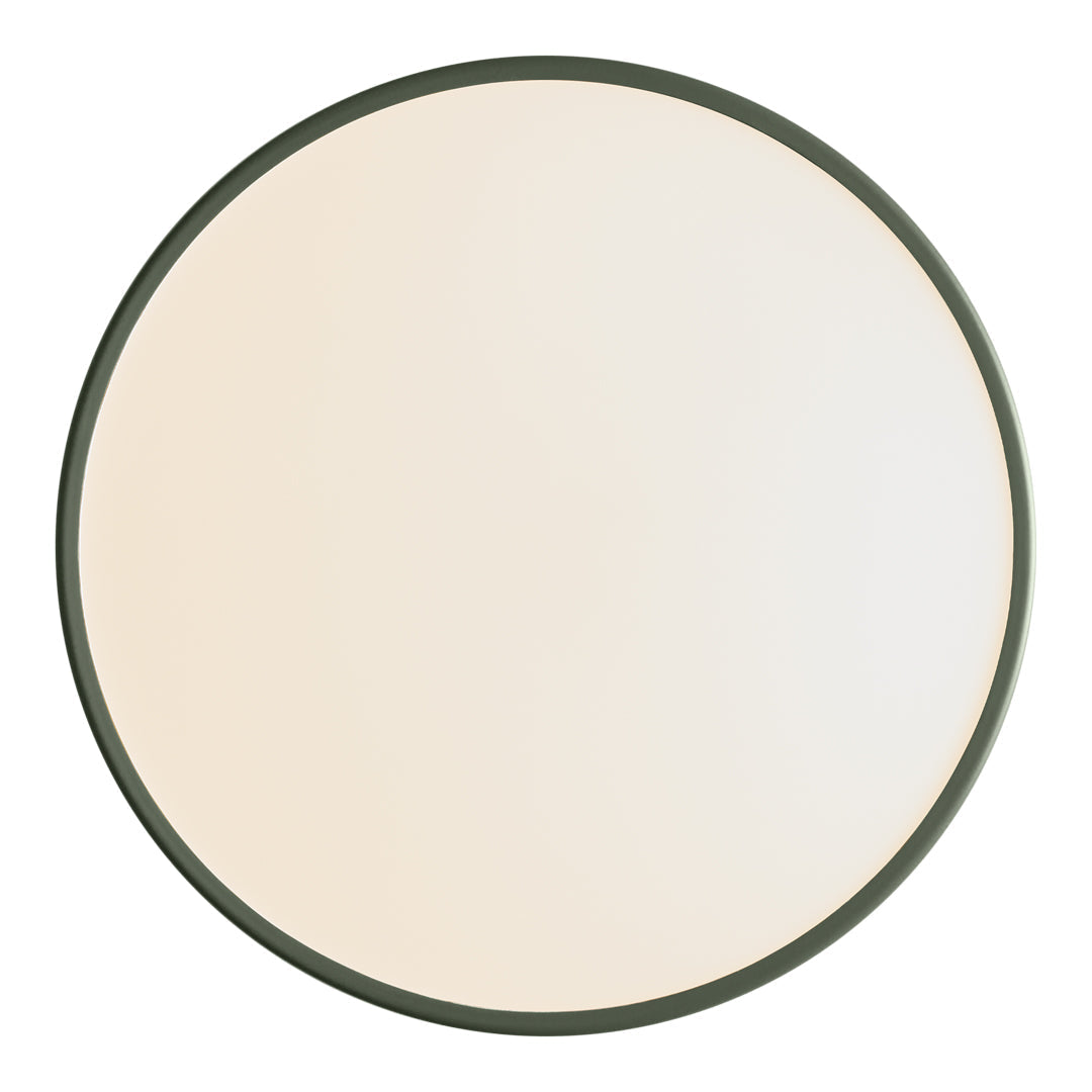 Round mirror with a sleek dark green frame and a smooth, reflective surface in soft white tones.