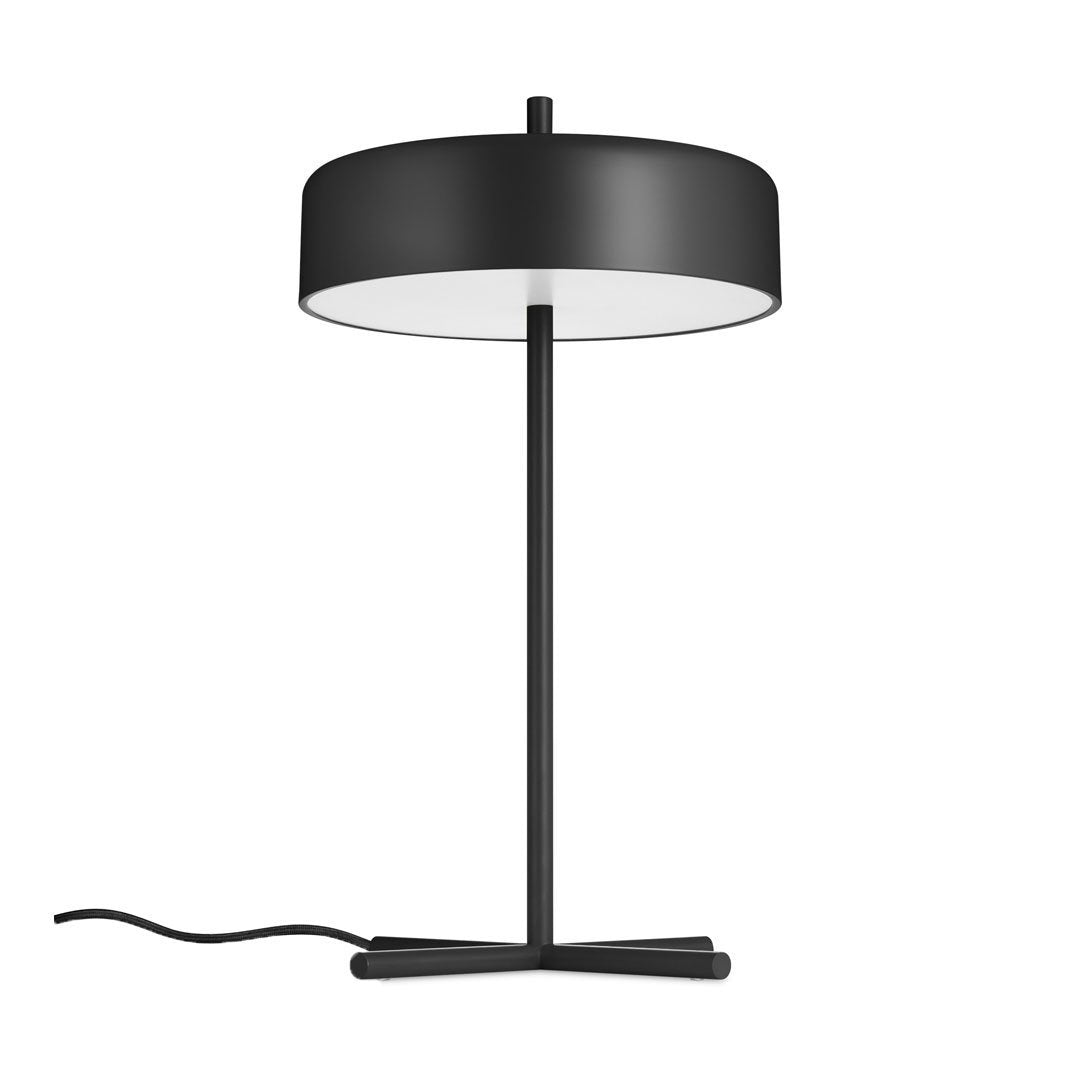 Modern black table lamp with a round shade, featuring a sleek minimalist design and contrasting white interior.
