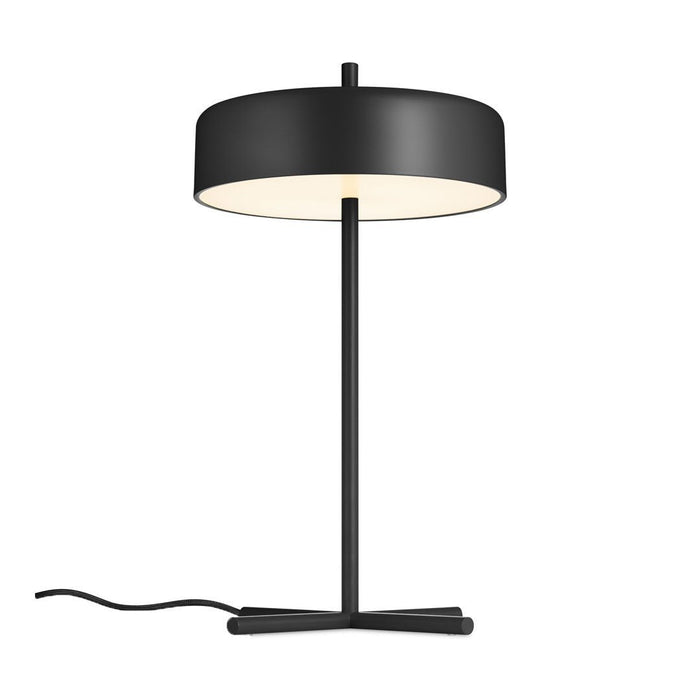 Black table lamp with a sleek round shade and contrasting white interior, featuring a minimalist design and elegant lines.