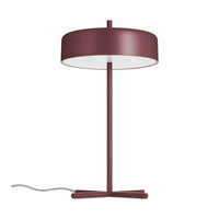 Burgundy table lamp with a sleek, round shade and minimalist design, featuring a white interior for illuminated elegance.