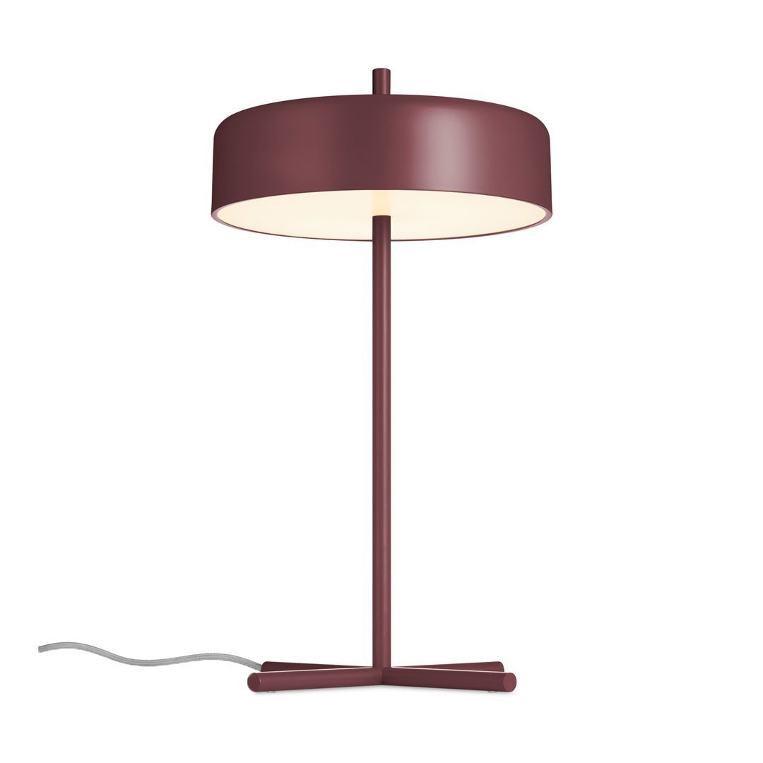 Modern burgundy table lamp with a round shade and sleek metal base, featuring a minimalist design and warm white light.