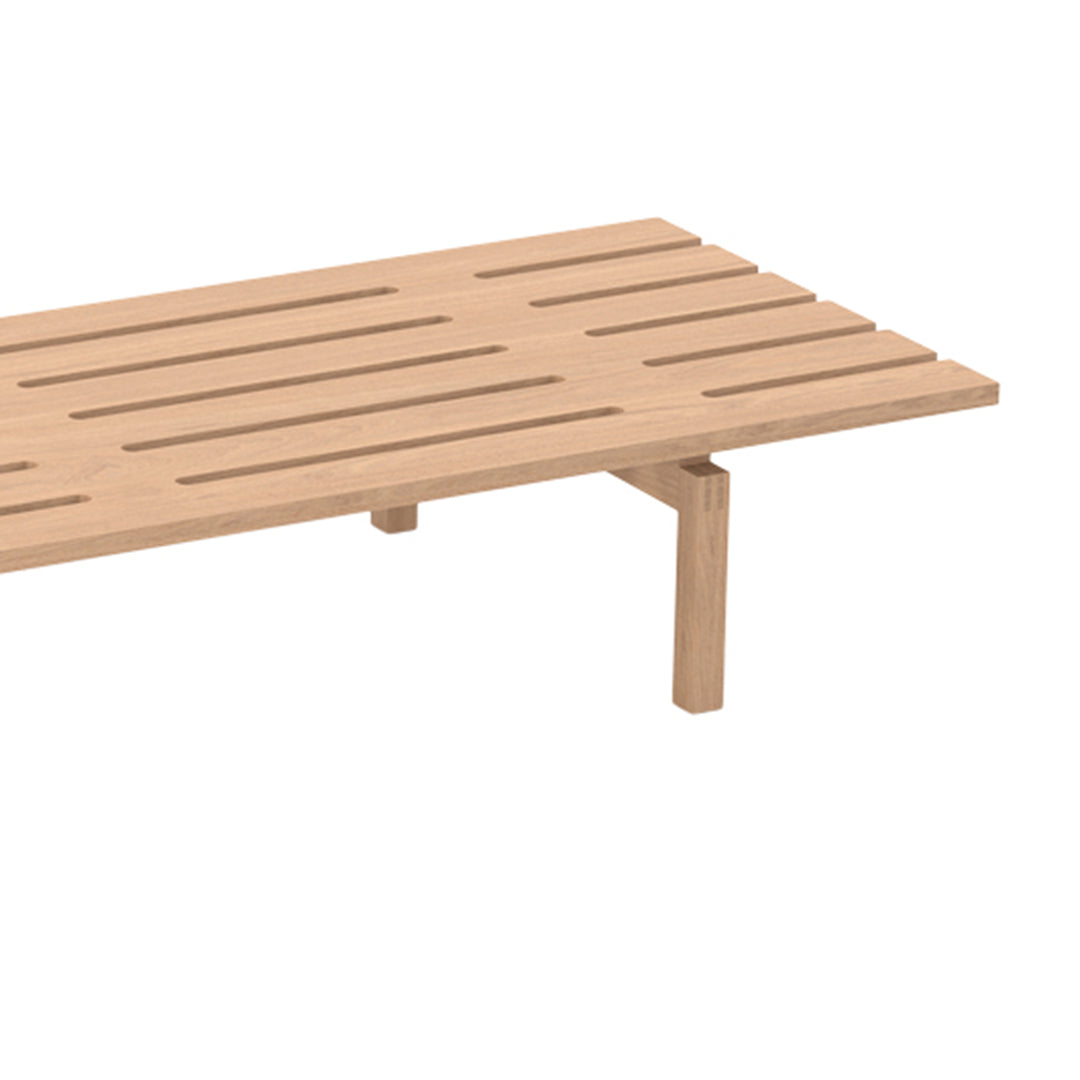 Natural wood slatted table with a light beige finish, featuring minimalist design and clean lines.
