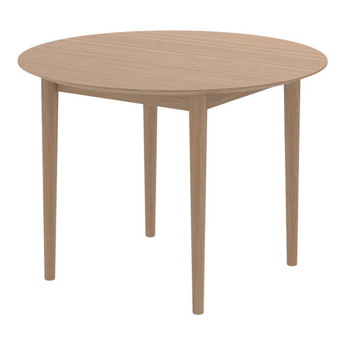 Round wooden dining table in a light oak finish with a smooth, natural grain pattern. Perfect for modern decor.