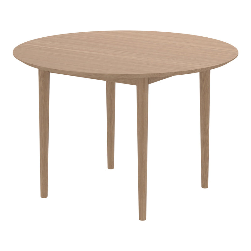 Light oak round dining table with simple, natural wood grain pattern and smooth finish. Ideal for modern interiors.