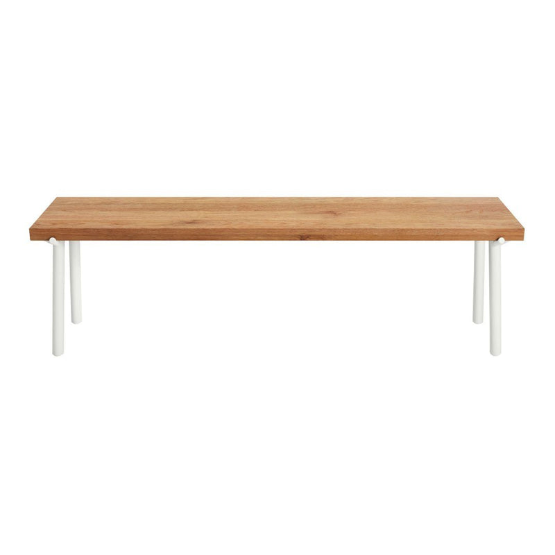 Natural wood tabletop with a warm brown finish and sleek white legs, offering a modern minimalist look.