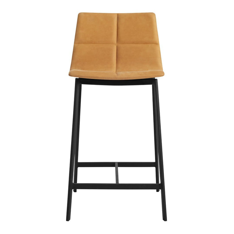 Tan upholstered bar stool featuring a quilted pattern and sleek black metal legs. Ideal for modern decor.