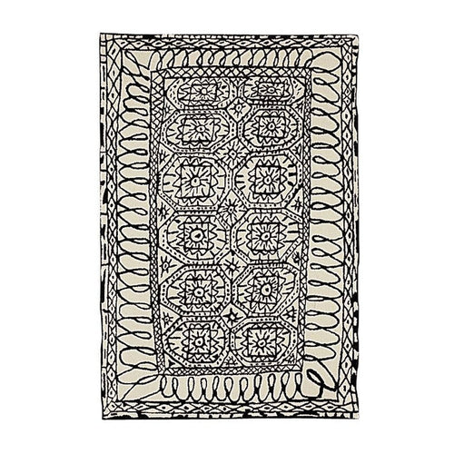 Black and cream geometric patterned rug featuring intricate designs and flowing lines. Perfect for stylish decor.