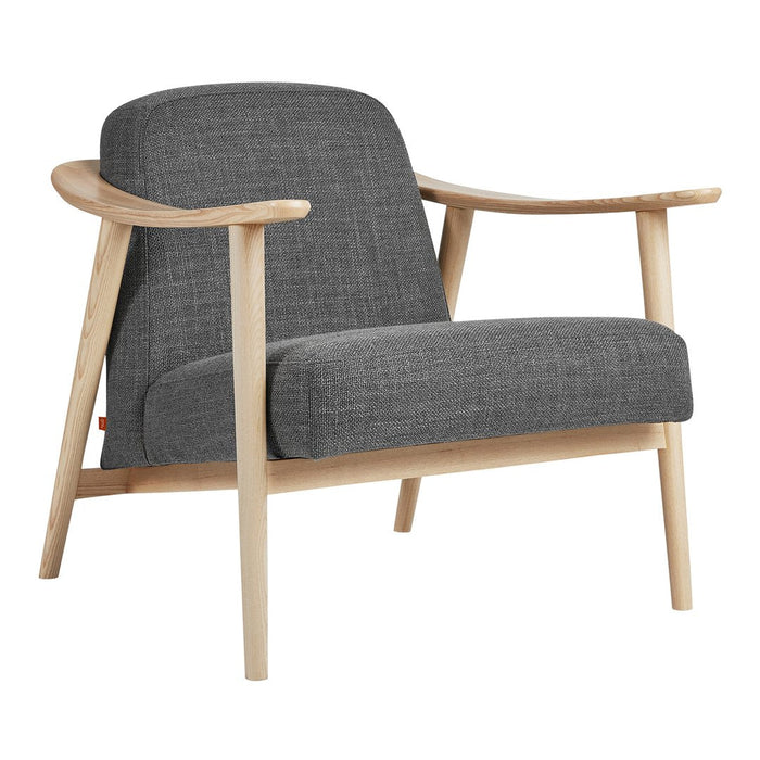 Gray textured fabric armchair with light wood frame, featuring a modern, minimalist design. Perfect for stylish interiors.