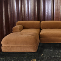 Brown velvet sectional sofa with plush texture and clean, modern lines, perfect for stylish living spaces.