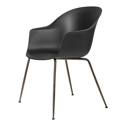 Black armchair with a smooth finish and sleek bronze legs, perfect for modern decor.