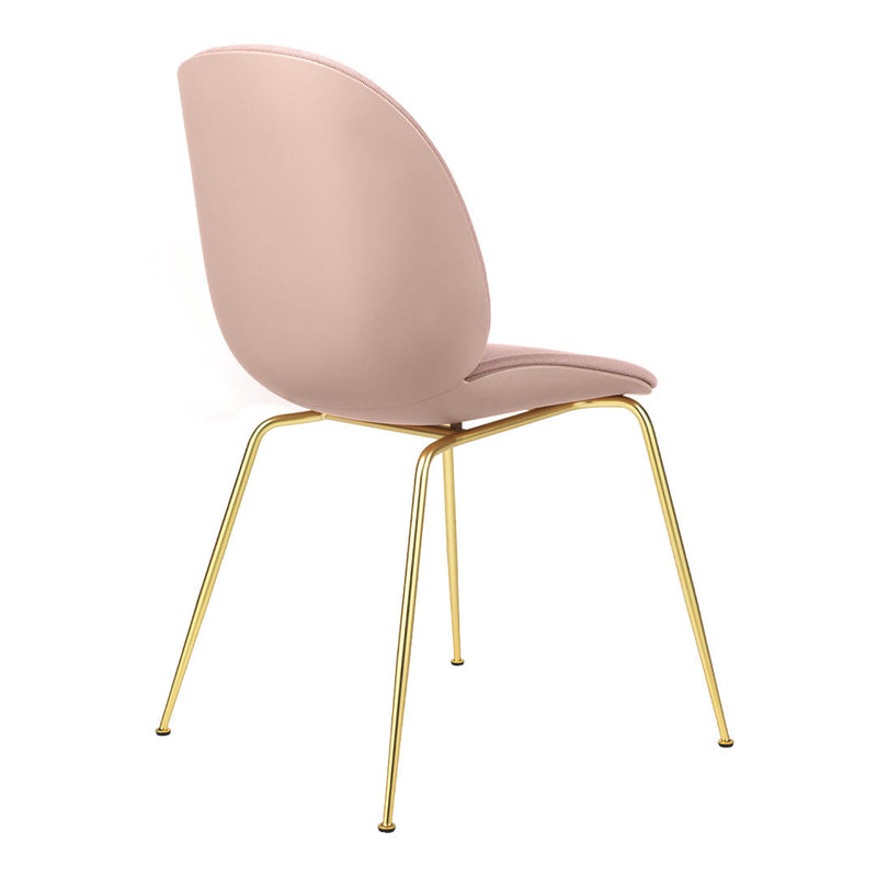 Stylish blush pink chair with smooth curves and elegant gold metal legs. Perfect for modern decor.