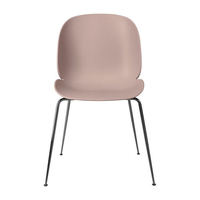 Rose pink chair with smooth, matte finish and sleek black metal legs. Simple, modern design without patterns.