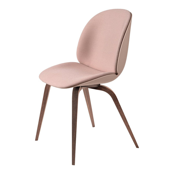 Soft pink upholstered chair with sleek, rounded lines and contrasting dark wood legs. Perfect for modern interiors.
