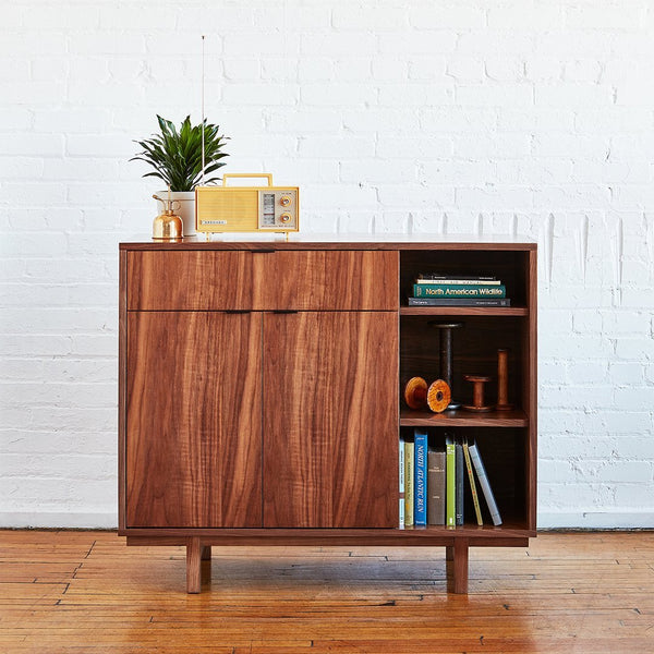 Mid-century walnut cabinet with natural wood grain, featuring rich brown tones and sleek minimalist design.