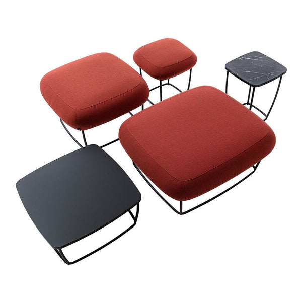 Set of five modern stools featuring bold red and sleek black upholstery with smooth geometric shapes and contrasting wire frames.