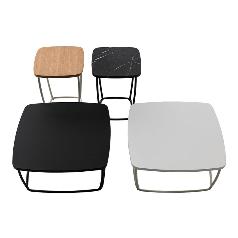 Four stylish side tables in black, white, wood, and grey marble patterns, featuring sleek metal legs.