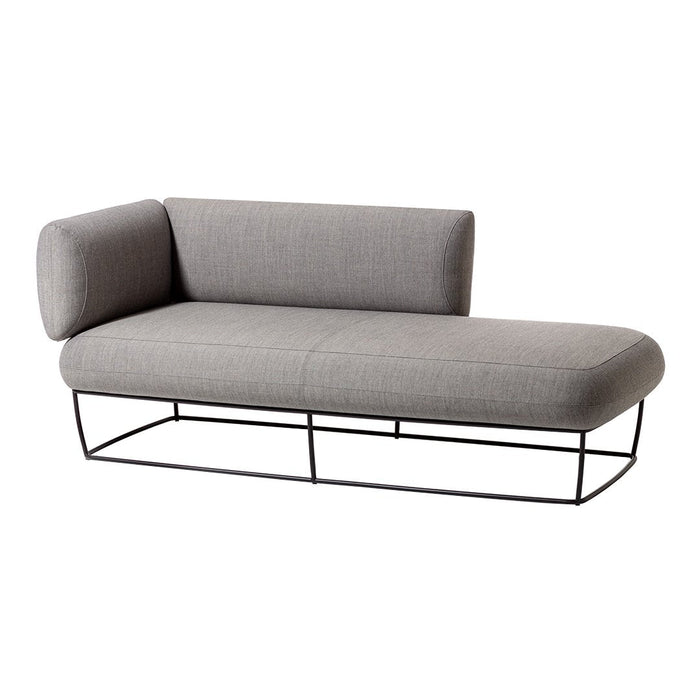 Stylish gray fabric chaise lounge with a minimalist black metal frame. Perfect for modern interiors.
