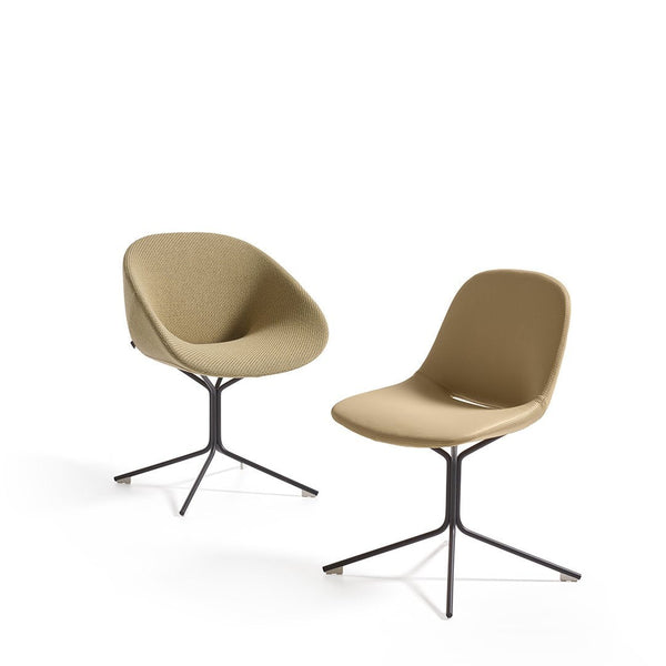 Tan upholstered chairs with smooth, rounded designs and sleek black metal bases, offering a modern aesthetic.