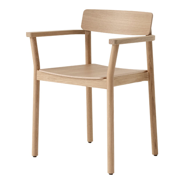 Light oak wooden chair with a natural finish and minimalistic design, showcasing a smooth texture and clean lines.