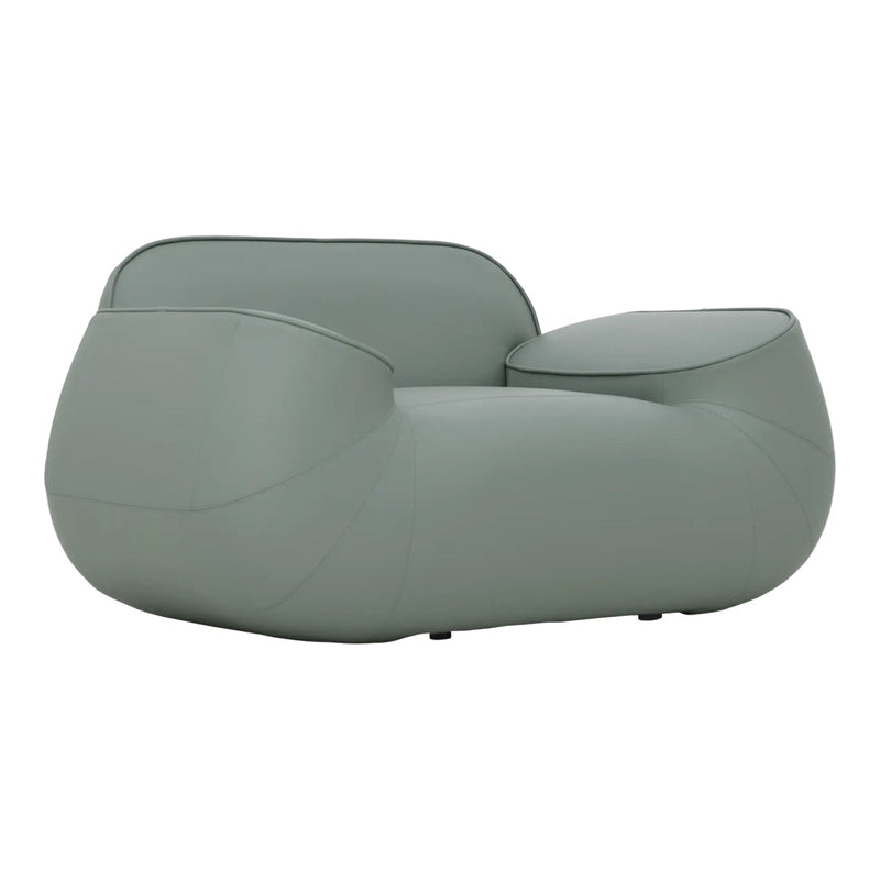 Curved soft sofa in muted sage green with a smooth, glossy finish, perfect for modern interiors.