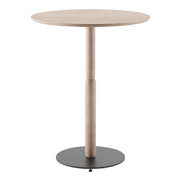 Round wooden table with a light oak finish and a black circular base, showcasing a modern and minimalist design.