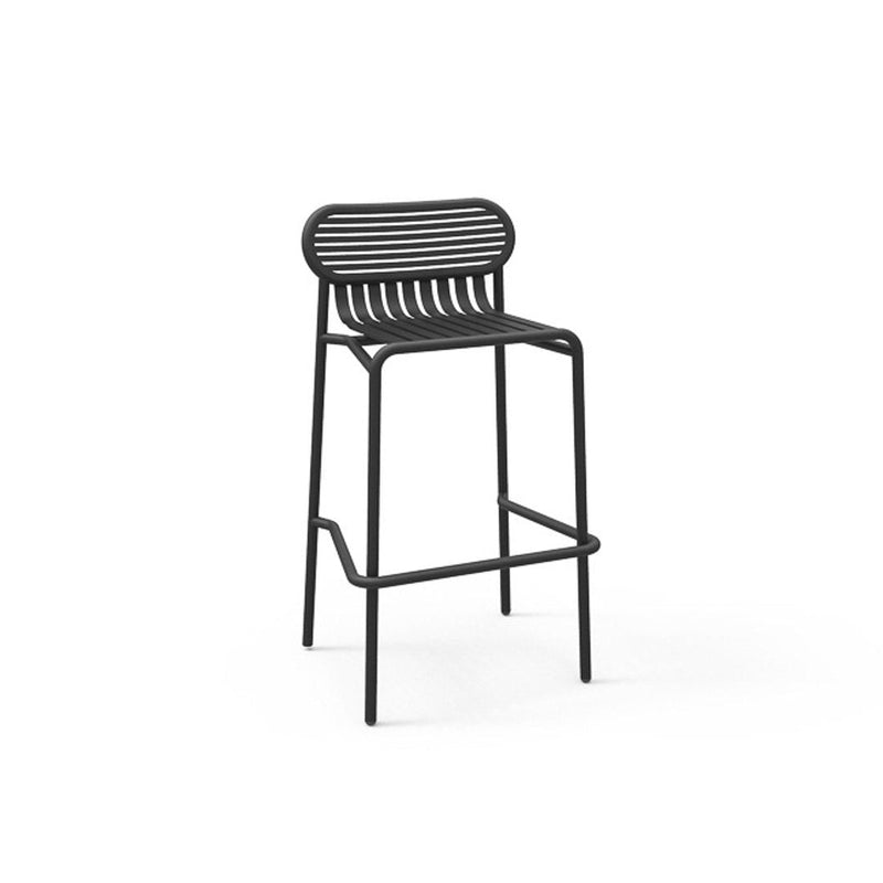 Black metal bar stool with horizontal slats and a minimalist design, perfect for modern decor.