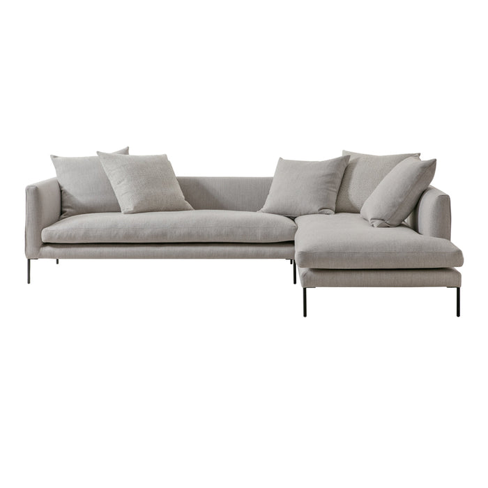 Light gray sectional sofa with plush cushions and sleek metal legs, featuring a modern, minimalist design.