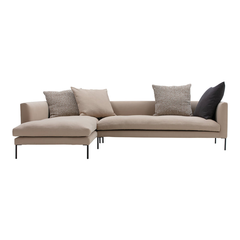 Beige sectional sofa with textured and solid throw pillows in subtle patterns, perfect for modern living spaces.