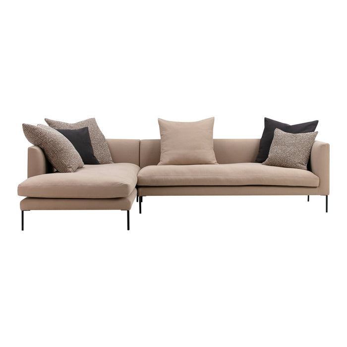 Beige sectional sofa with black and textured throw pillows, featuring a sleek modern design and minimalist style.