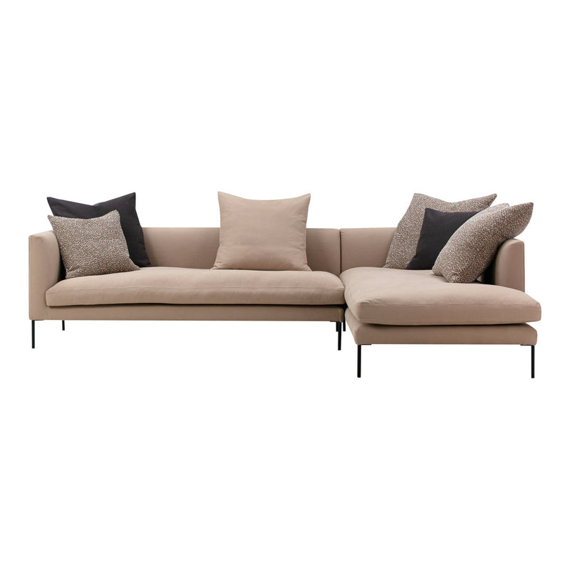 Beige sectional sofa with black and textured throw pillows, featuring a modern minimalist design.