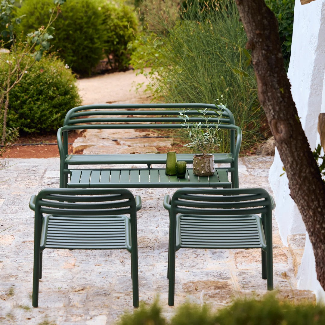 Green metal outdoor seating set featuring striped patterns, perfect for gardens and patios.