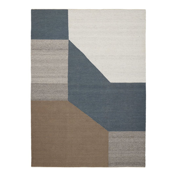 Geometric rug featuring muted tones of blue, gray, and brown in a modern patchwork design.