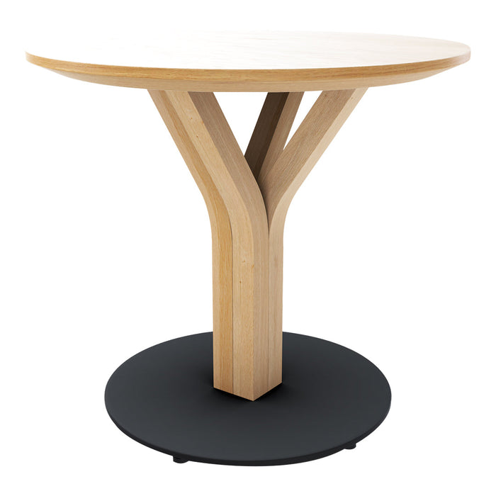 Round wooden table with a light brown top, natural wood legs, and a sleek black circular base. Modern design.