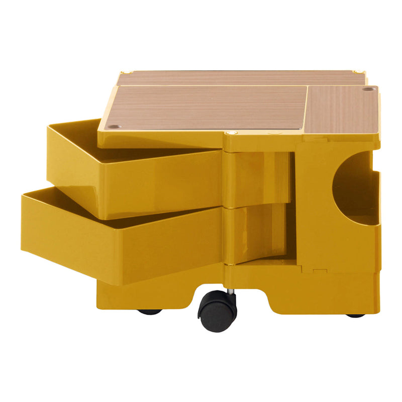 Yellow storage cart with smooth surfaces and wooden top, featuring three pull-out drawers for organized storage.