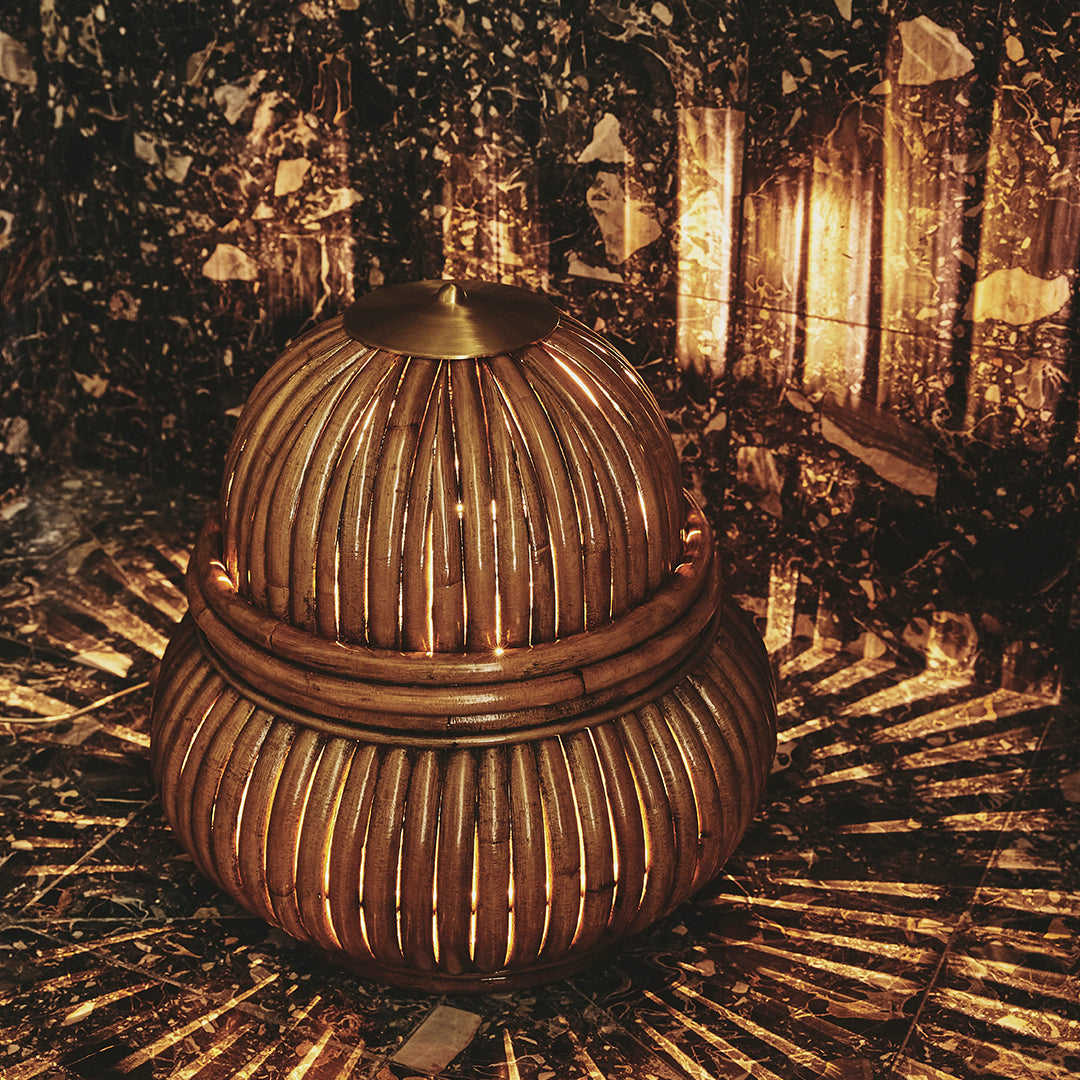 Natural wooden basket in brown tones, featuring a rounded shape and intricate woven pattern, ideal for home decor.