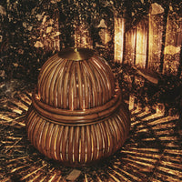 Natural wooden basket in brown tones, featuring a rounded shape and intricate woven pattern, ideal for home decor.