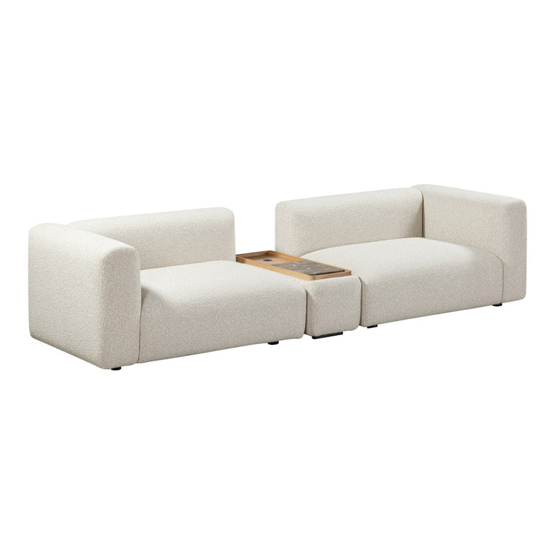 Beige modular sofa with a textured fabric and minimalist design, featuring a wooden accent table. Perfect for modern decor.