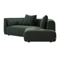 Dark green textured sofa with plush cushions and a modern curved design. Perfect for contemporary living spaces.