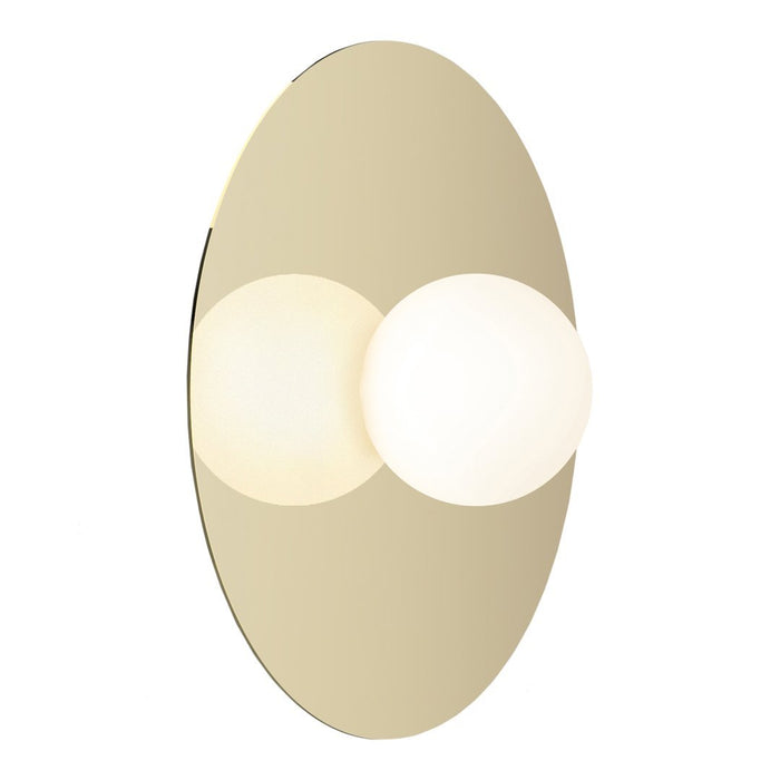 Modern gold wall sconce with a smooth oval mirror and two white globe lights. Elegant and minimalist design.