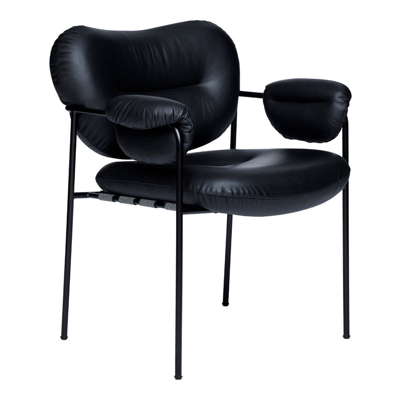 Black leather chair with a modern design and curved patterns, featuring black metal legs for a sleek, contemporary look.