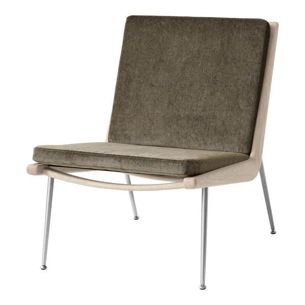 Modern lounge chair in earthy olive green upholstery with a sleek light wood frame and silver metal legs.