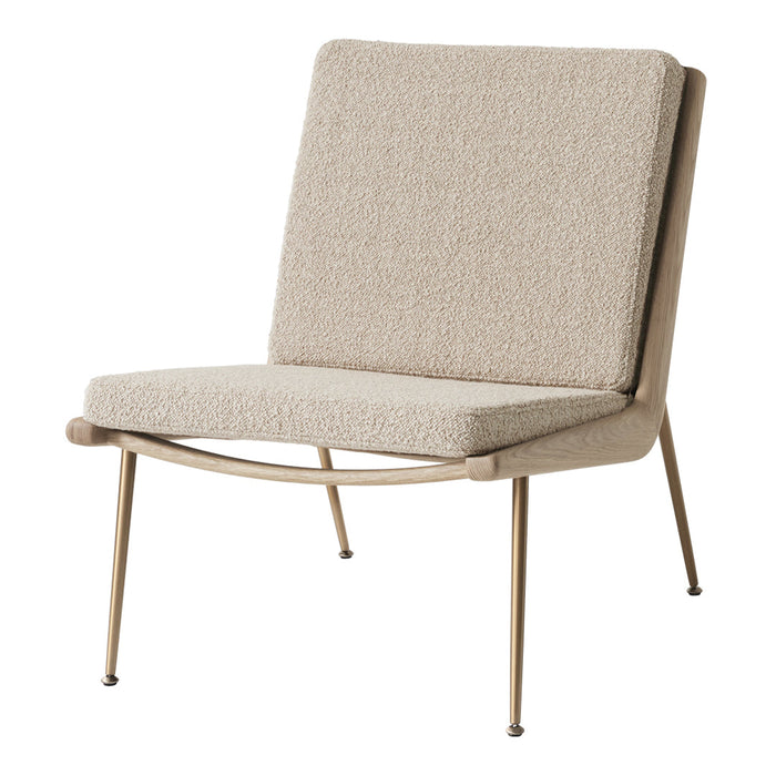 Beige textured fabric chair with minimalist design and sleek gold legs, perfect for modern decor.