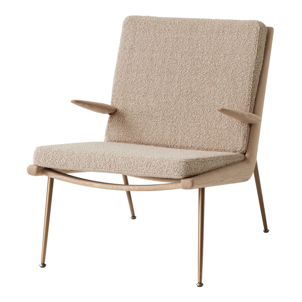 Beige upholstered chair with textured fabric and sleek metal legs, offering a modern minimalist design.