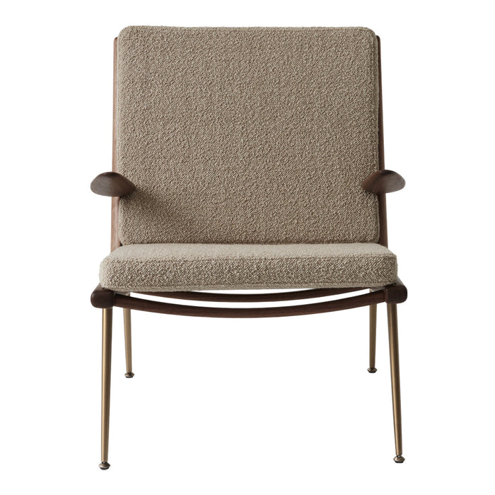 Light beige textured upholstery chair with wooden armrests and slender metal legs. Modern and minimalist design.