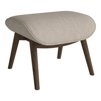 Beige upholstered stool with a smooth texture and dark wood legs, featuring a sleek, contemporary design.