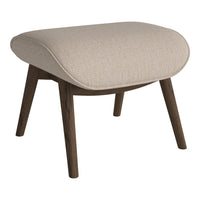 Beige upholstered ottoman with textured fabric and dark wooden legs, featuring a modern, rounded design.